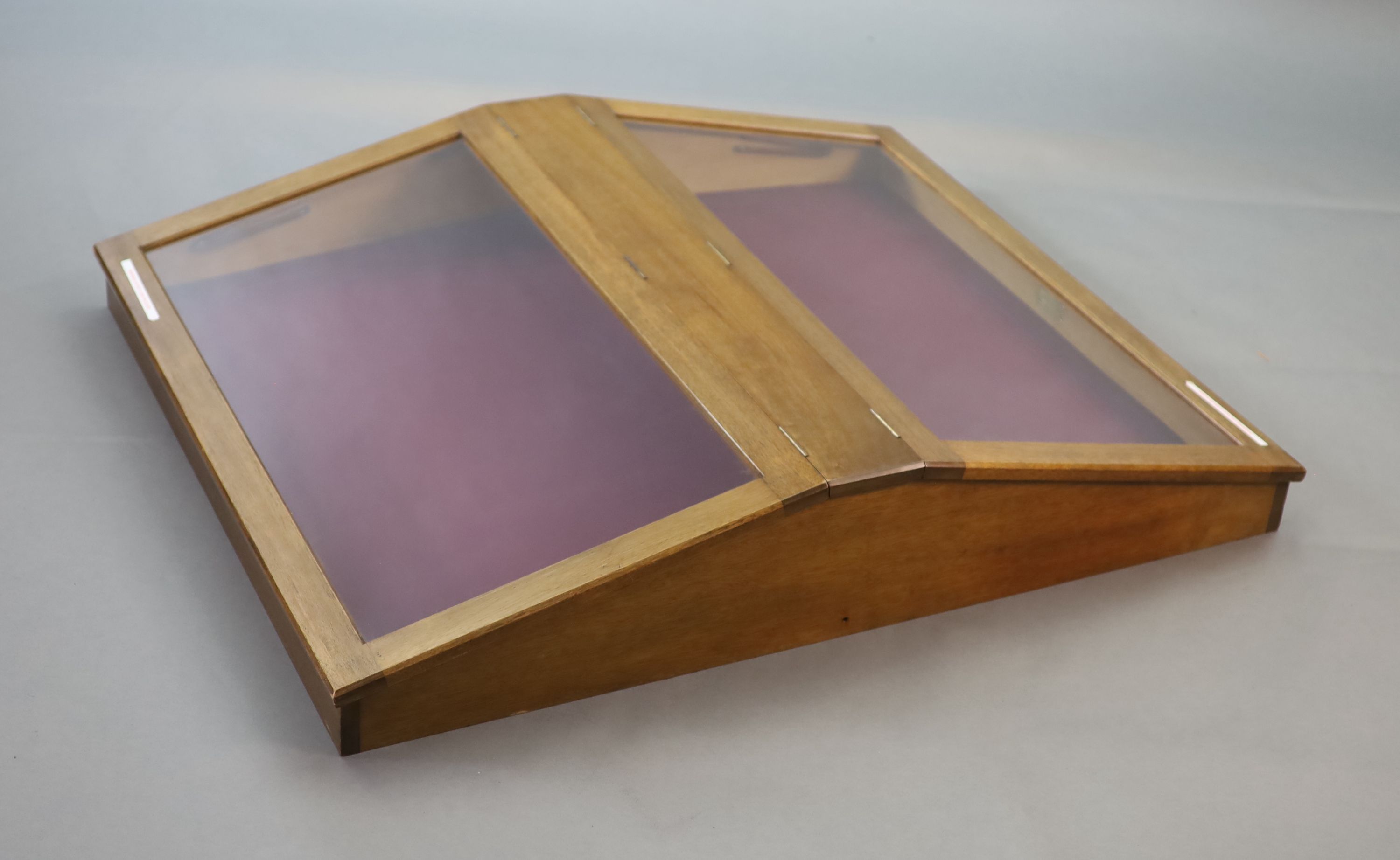 A 20th century teak table top double display case, from the Library of the Royal College of Surgeons, width 103cm depth 128cm height 108cm